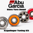 Auf weiΓem Hintergrund sind vier Kugellager in verschiedenen Farben abgebildet. Text: RL-TNG Kugellager Tuning Kit fΓΌr Abu Garcia Revo Toro Beast | Hybrid Spulenlager & Pinionlager Set | RL-Angelrollentuning.