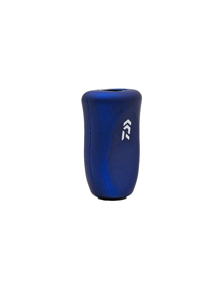 Ein blauer, ergonomisch geformter, zylindrischer RCS i-Shape Cork Knob von SLP Works mit einem kleinen Logo aus zwei weißen Pfeilen, hergestellt aus glattem Material und fotografiert vor einem weißen Hintergrund.