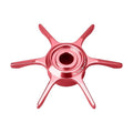 Eine metallisch pinke, sechsspeichige, sternförmige Fahrradnabe im Stardrag-Design mit „Gomexus“-Branding vor weißem Hintergrund. Produkt: Gomexus Sternbremse 65 mm | Daiwa.