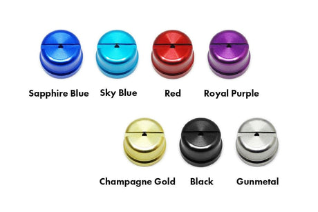 Sieben Hedgehog Studio Shimano Level Wind Caps werden in einem Raster angezeigt, jede in einer anderen Farbe – Saphirblau, Himmelblau, Rot, Königsviolett, Champagnergold, Schwarz und Rotguss – kompatibel mit 22 ALDEBARAN BFS und mehr.