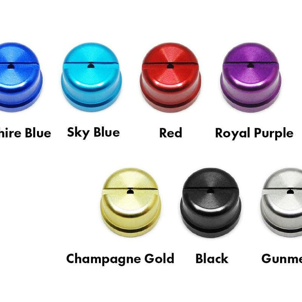 Sieben Hedgehog Studio Shimano Level Wind Caps werden in einem Raster angezeigt, jede in einer anderen Farbe – Saphirblau, Himmelblau, Rot, Königsviolett, Champagnergold, Schwarz und Rotguss – kompatibel mit 22 ALDEBARAN BFS und mehr.