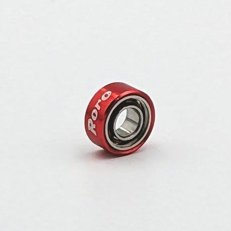 Ein kleines, rotes Roro Köder Roro BFS Keramik Kugellager mit 