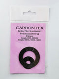 Ein Smoothdrag Bremsscheiben Carbontex-Pack für Shimano Baitcasterrollen enthält zwei schwarze runde Scheiben, die auf einem rosa Hintergrund in einer durchsichtigen Kunststoffverpackung abgebildet sind, und verspricht eine verbesserte Bremskraft für Ihre Angelrolle.